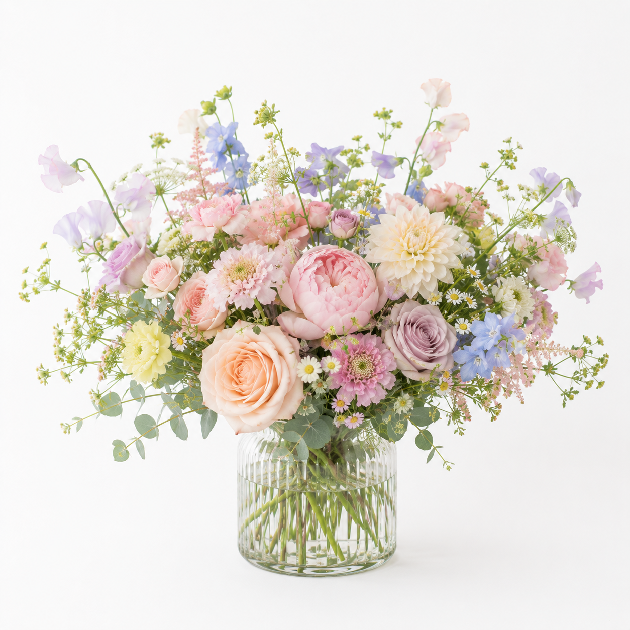 Soft pastel vase arrangement in a garden style